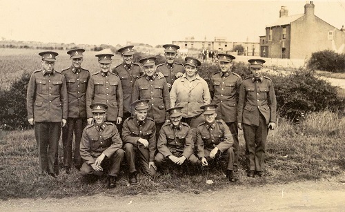Soldiers standing opposite Gwendene with Warrenby Cottage in background, 1940s