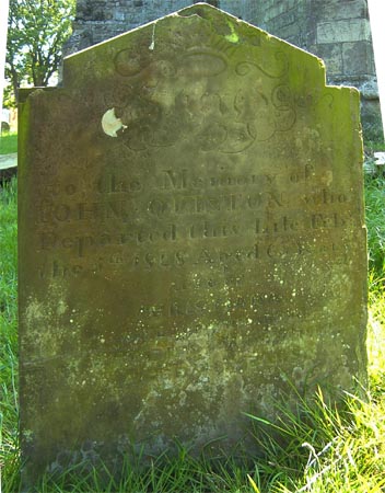 The gravestone of John Quinton and his wife Christiana