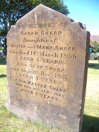 The gravestone of three children of the Sharp family