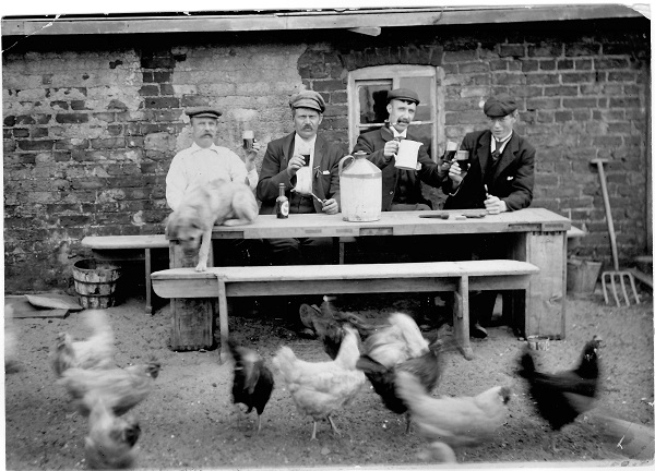 Customers, chickens and dog outside Lifeboat Inn, c. 1900