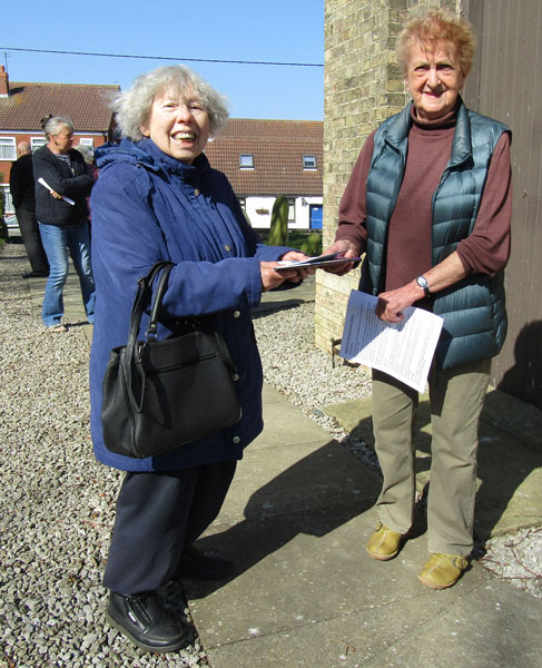 Dorothy Smith presents church warden, Ann Branton with the Easington church book